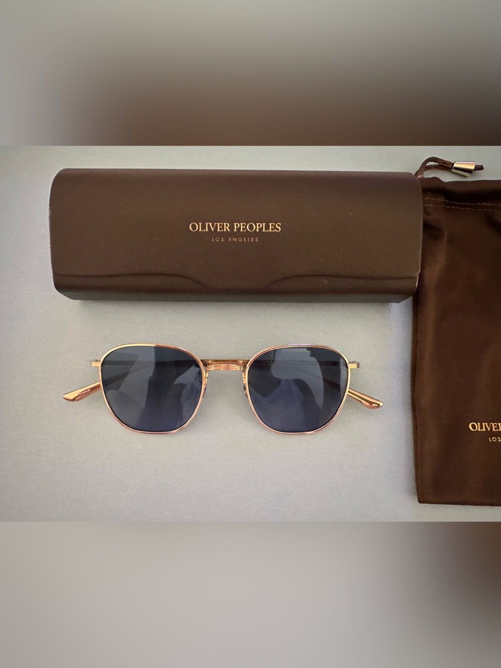 Oliver Peoples Gold Frame Sunglasses with Navy Lenses